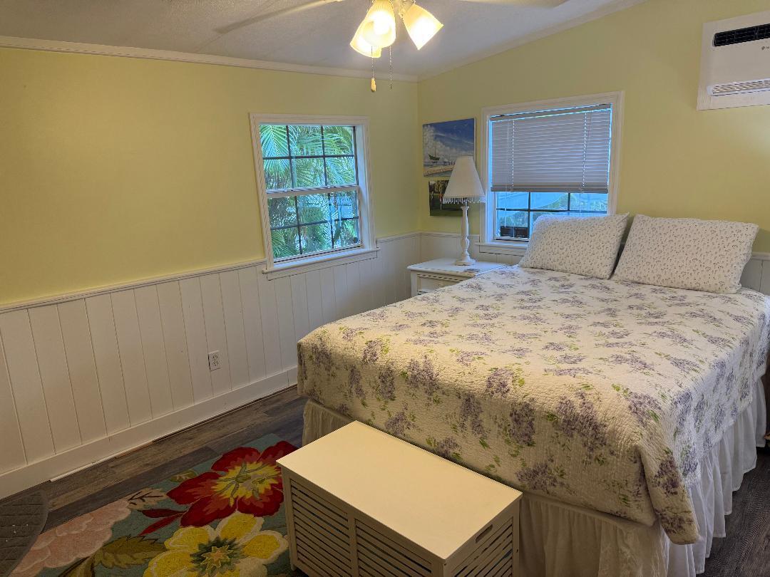 27973 Snapper Lane Summerland Key, FL 33042 - Photo 24 of 25 a bed sitting in a bedroom next to a window