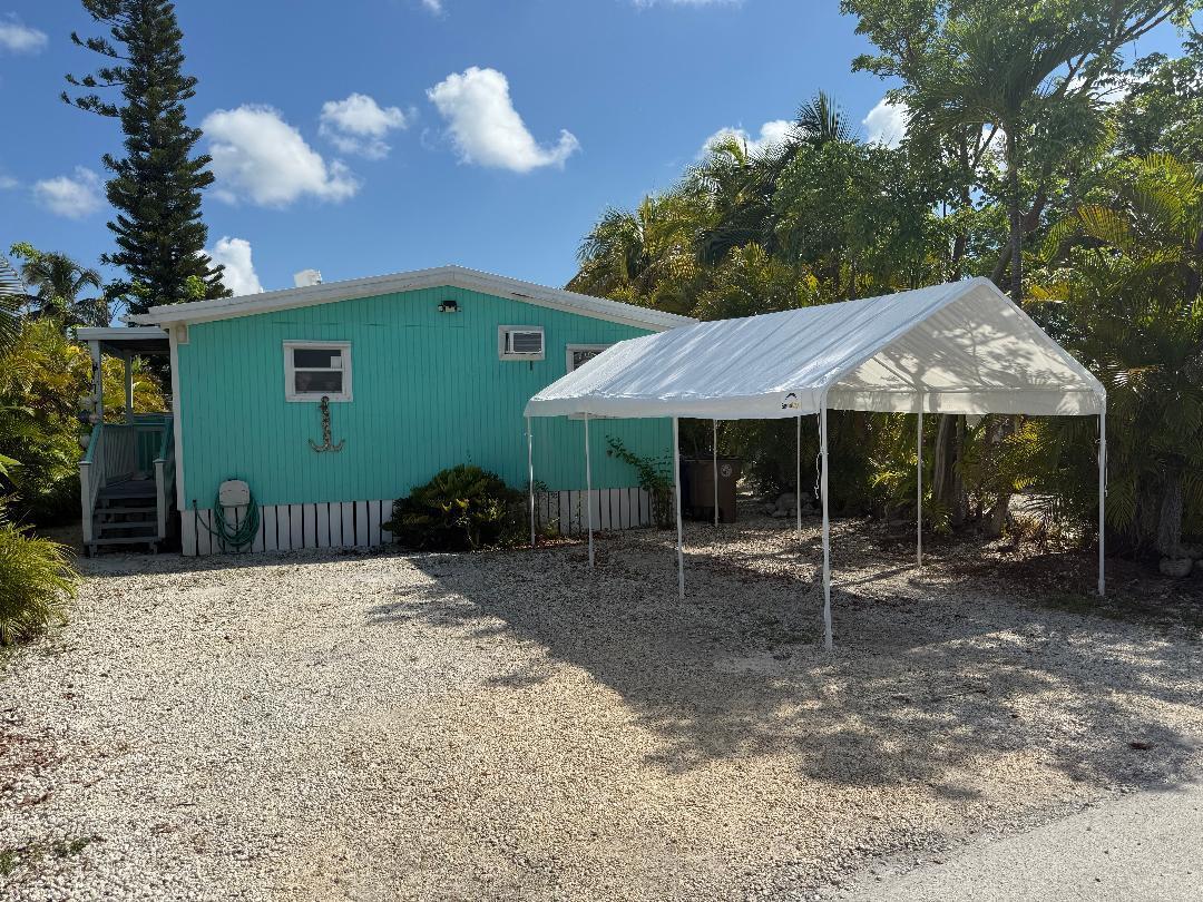 27973 Snapper Lane Summerland Key, FL 33042 - Photo 3 of 25 a view of a house with a backyard