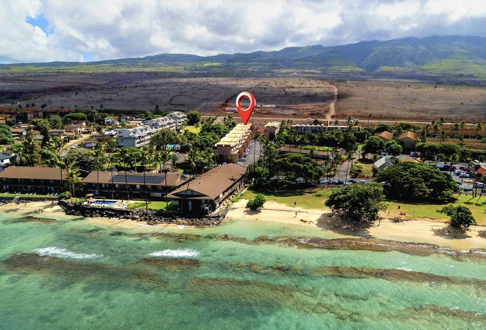 3676 Lower Honoapiilani Road, Unit F102 Lahaina, HI 96761 - Photo 1 of 12 a view of swimming pool with outdoor seating and covered with trees in the background