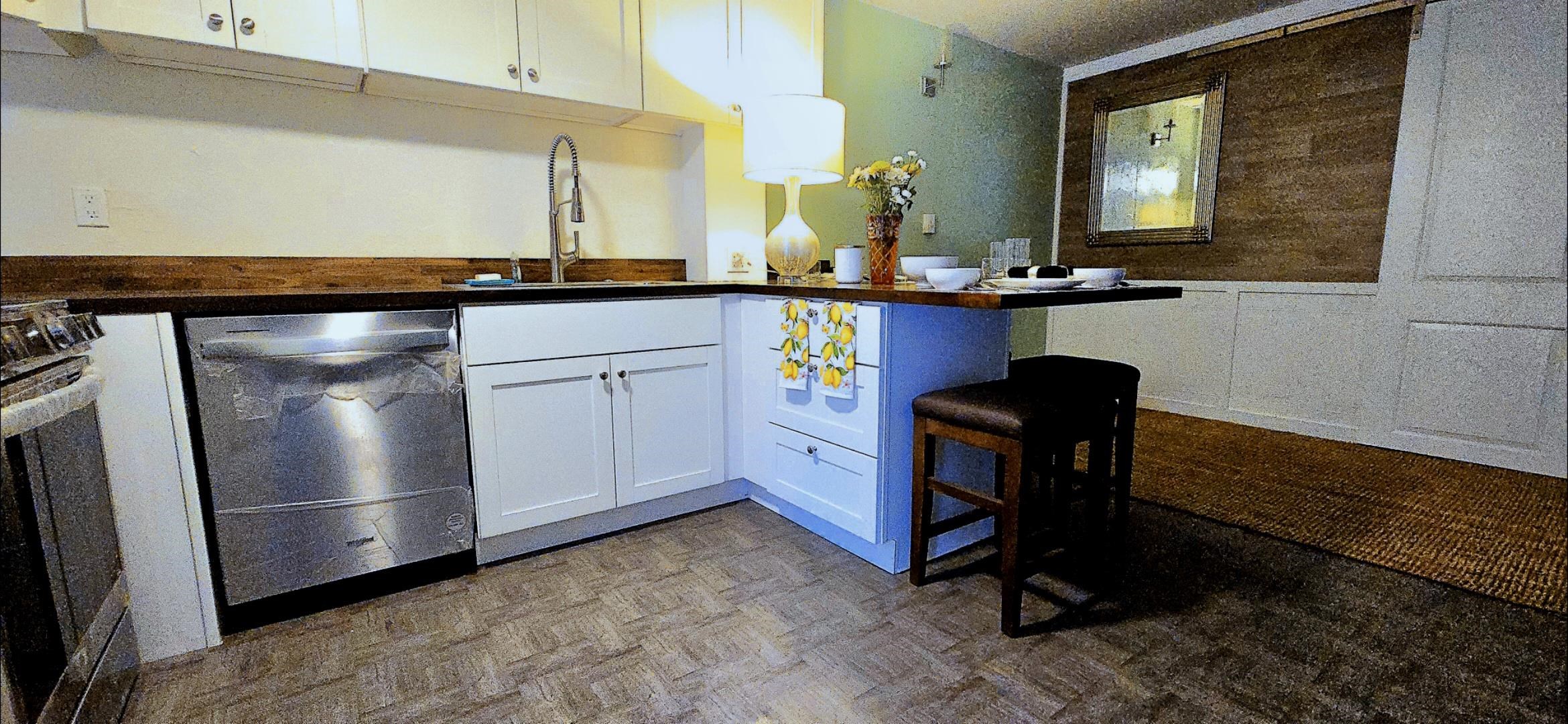 3676 Lower Honoapiilani Road, Unit F102 Lahaina, HI 96761 - Photo 3 of 12 a bathroom with a sink a mirror and a toilet