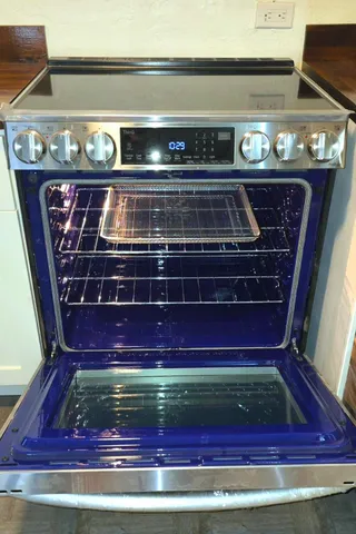 a kitchen with a stove and a microwave