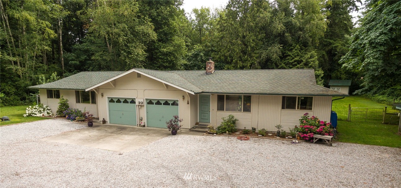 6742 North Enterprise Road Ferndale, WA 98248 - Photo 1 of 25 a view of a house with backyard and garden