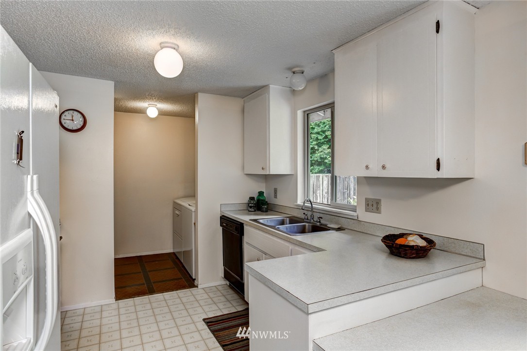 6742 North Enterprise Road Ferndale, WA 98248 - Photo 11 of 25 a kitchen with a refrigerator and a stove