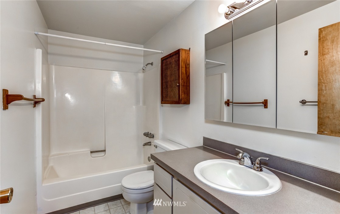6742 North Enterprise Road Ferndale, WA 98248 - Photo 17 of 25 a bathroom with a sink toilet and shower