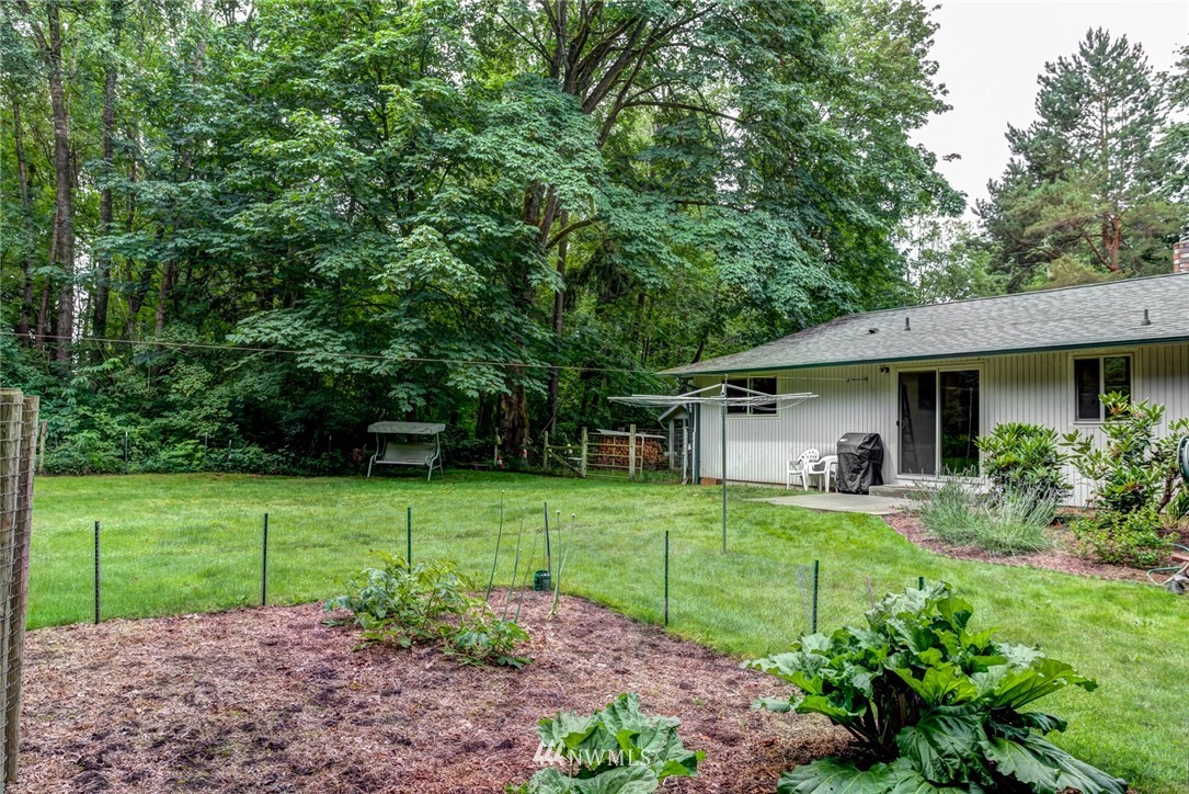 6742 North Enterprise Road Ferndale, WA 98248 - Photo 22 of 25 a view of a house with a backyard