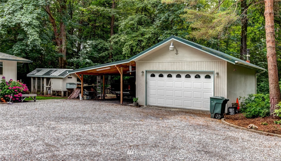6742 North Enterprise Road Ferndale, WA 98248 - Photo 23 of 25 a view of a house with a yard and garage