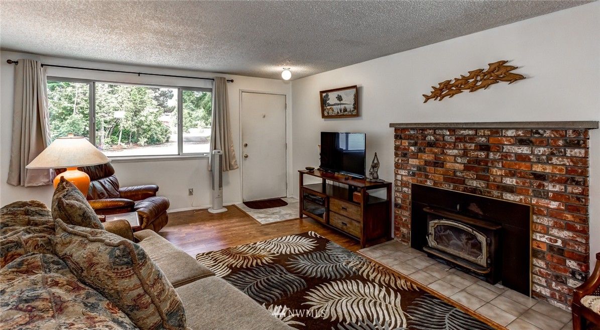 6742 North Enterprise Road Ferndale, WA 98248 - Photo 4 of 25 a bedroom with a bed and a fireplace