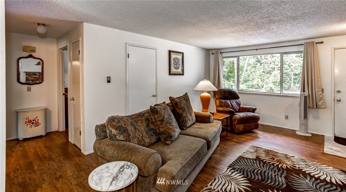 6742 North Enterprise Road Ferndale, WA 98248 - Photo 5 of 25 a living room with furniture and a window