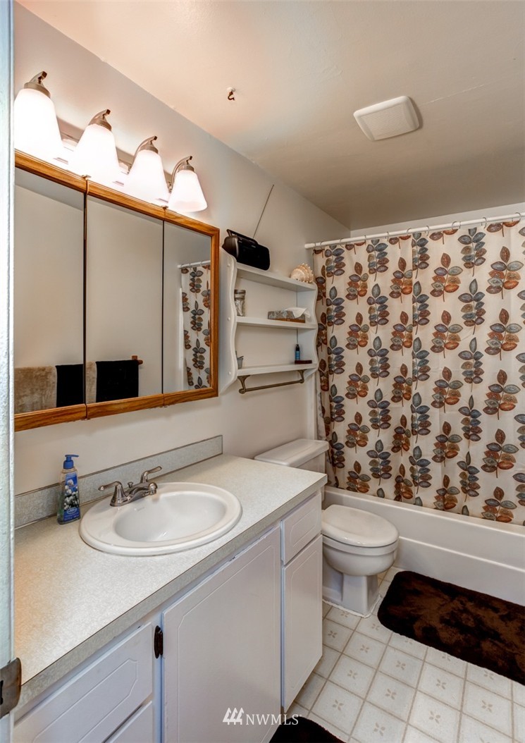 6742 North Enterprise Road Ferndale, WA 98248 - Photo 9 of 25 a bathroom with a sink toilet and shower