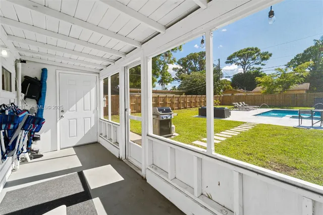 a view of a living room and floor to ceiling window