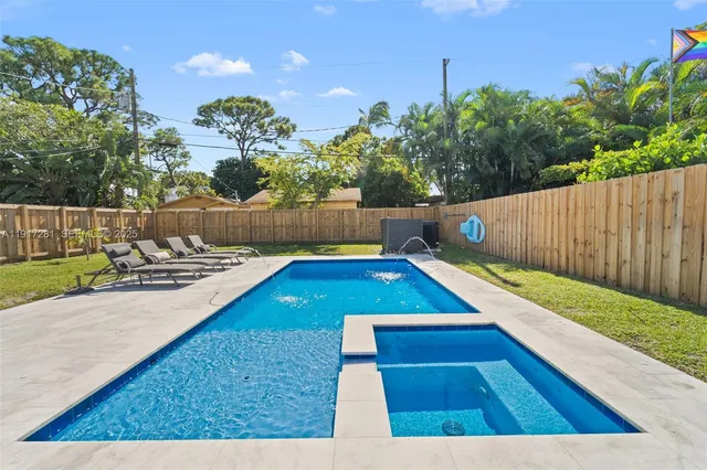 a view of a backyard with a small pool