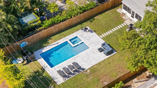 a view of a yard with an outdoor seating