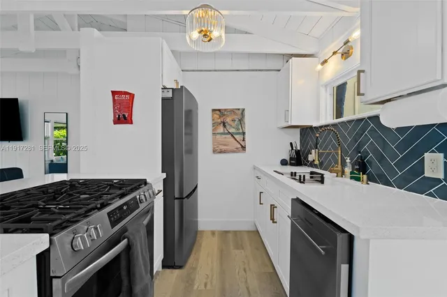 a kitchen with a stove and a refrigerator