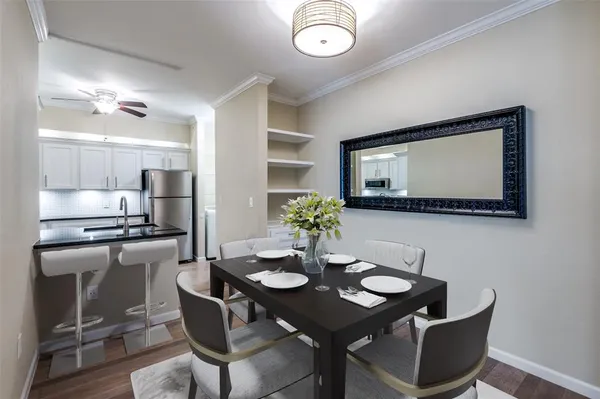 a kitchen with stainless steel appliances granite countertop a sink stove and microwave