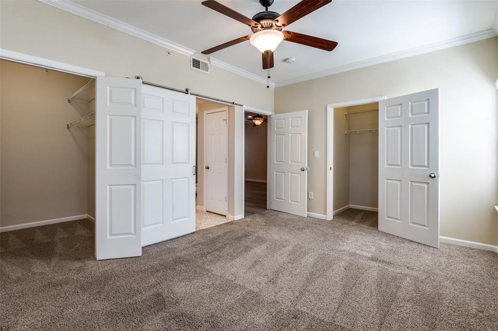 2601 Preston Road, Unit 3103 Plano, TX 75093 - Photo 19 of 30 an empty room with closet and a ceiling fan