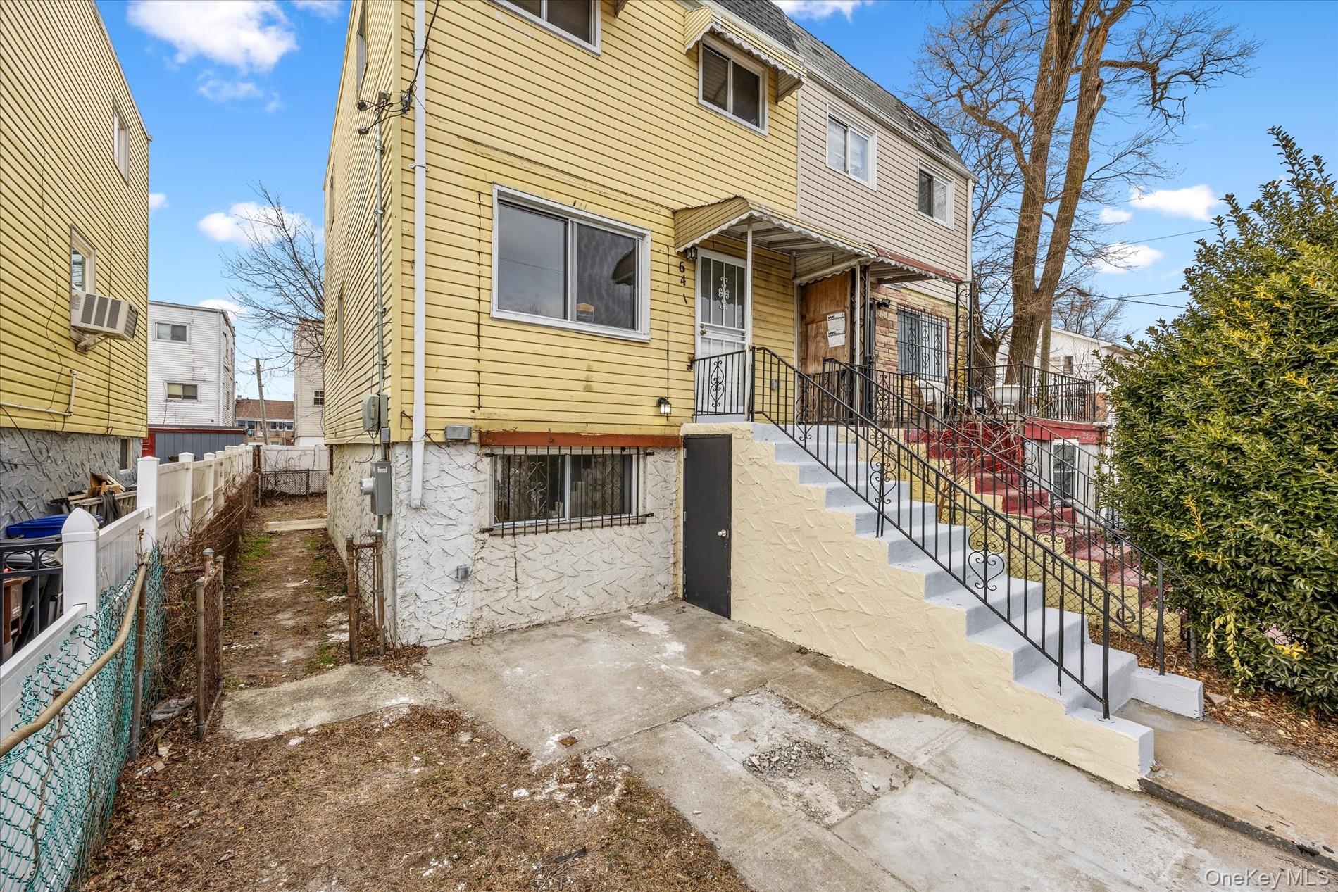 641 Beach 65th Street Queens, NY 11692 - Photo 4 of 34 a view of a house with a yard