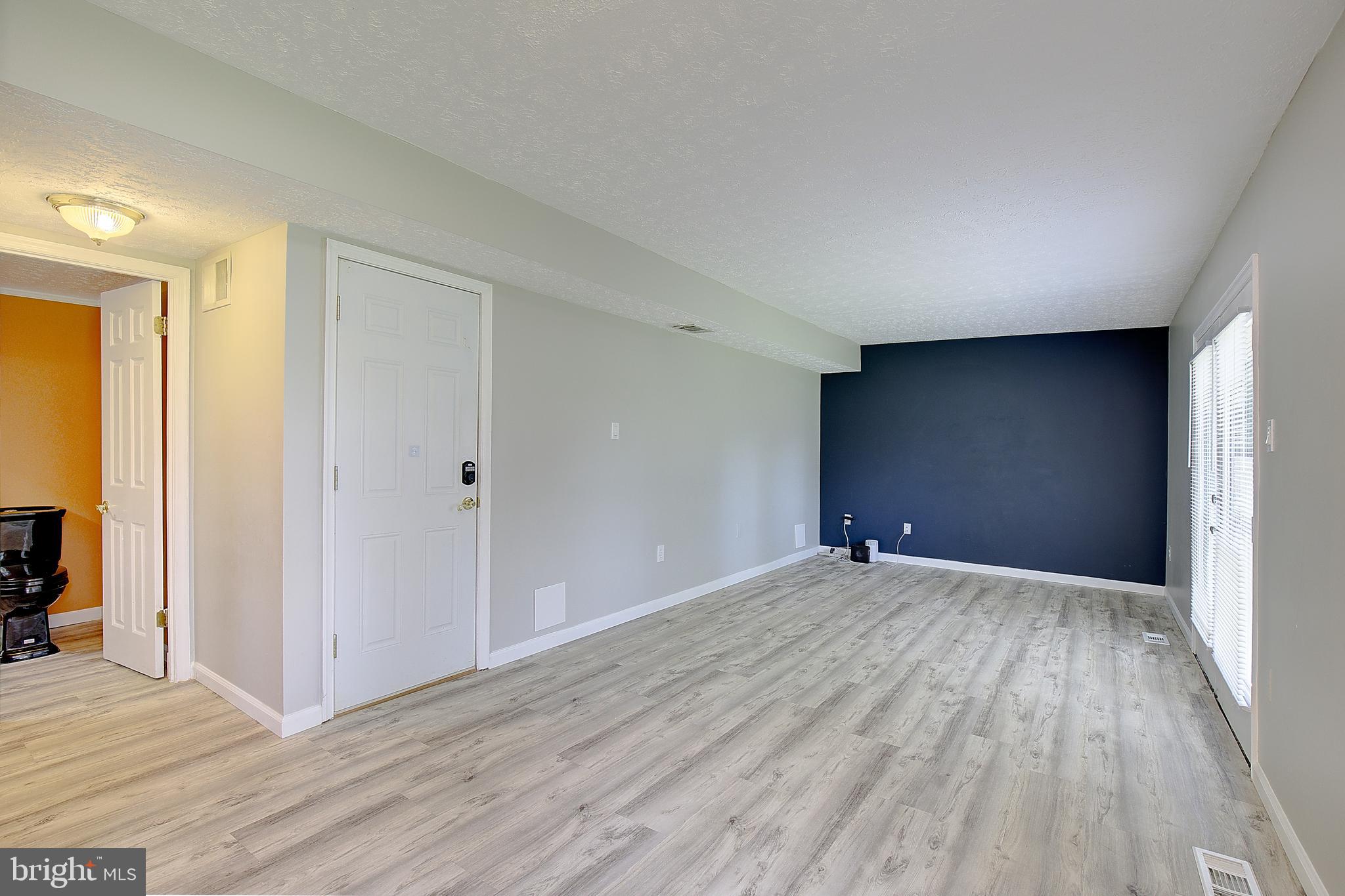 11611 Whittier Road Bowie, MD 20721 - Photo 17 of 39 Living Room/ Garage Entry- Main Level