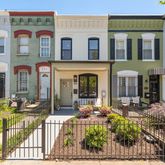a view of a brick building with large windows
