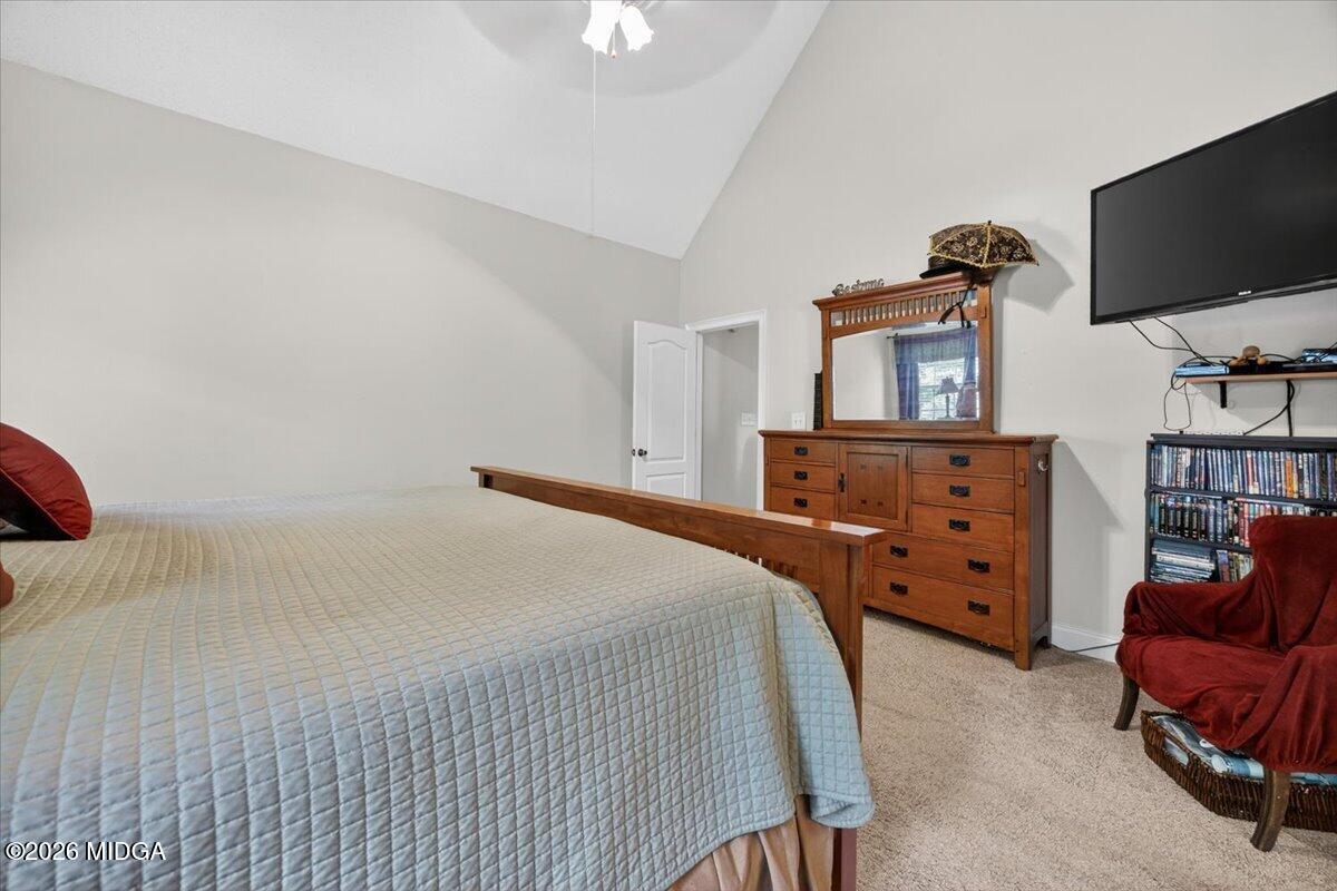 619 Grayridge Road Gray, GA 31032 - Photo 18 of 40 a bedroom with a bed and flat tv screen on wall