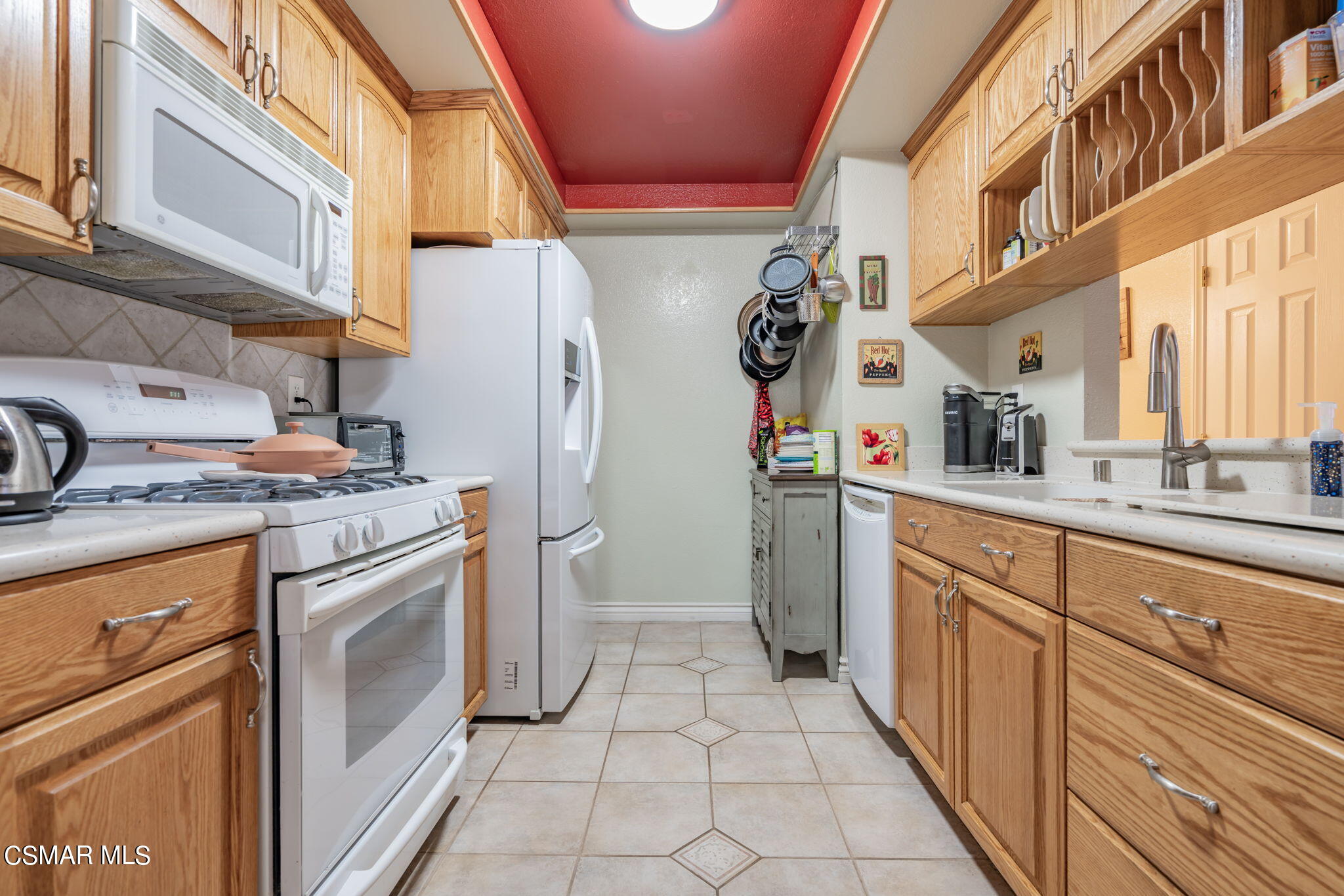 2044 Covington Avenue Simi Valley, CA 93065 - Photo 11 of 42 a kitchen with stainless steel appliances a white stove top oven a sink and dishwasher