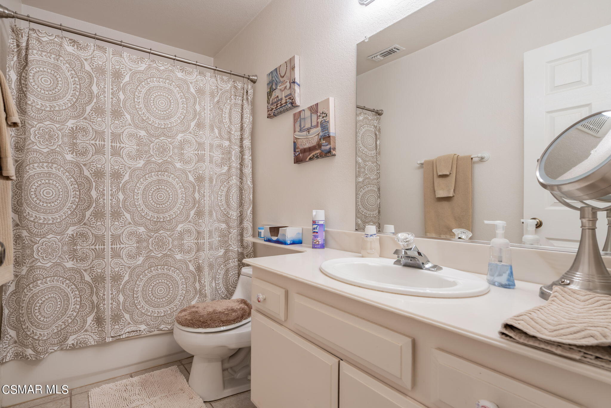 2044 Covington Avenue Simi Valley, CA 93065 - Photo 20 of 42 a bathroom with a granite countertop sink toilet and a mirror