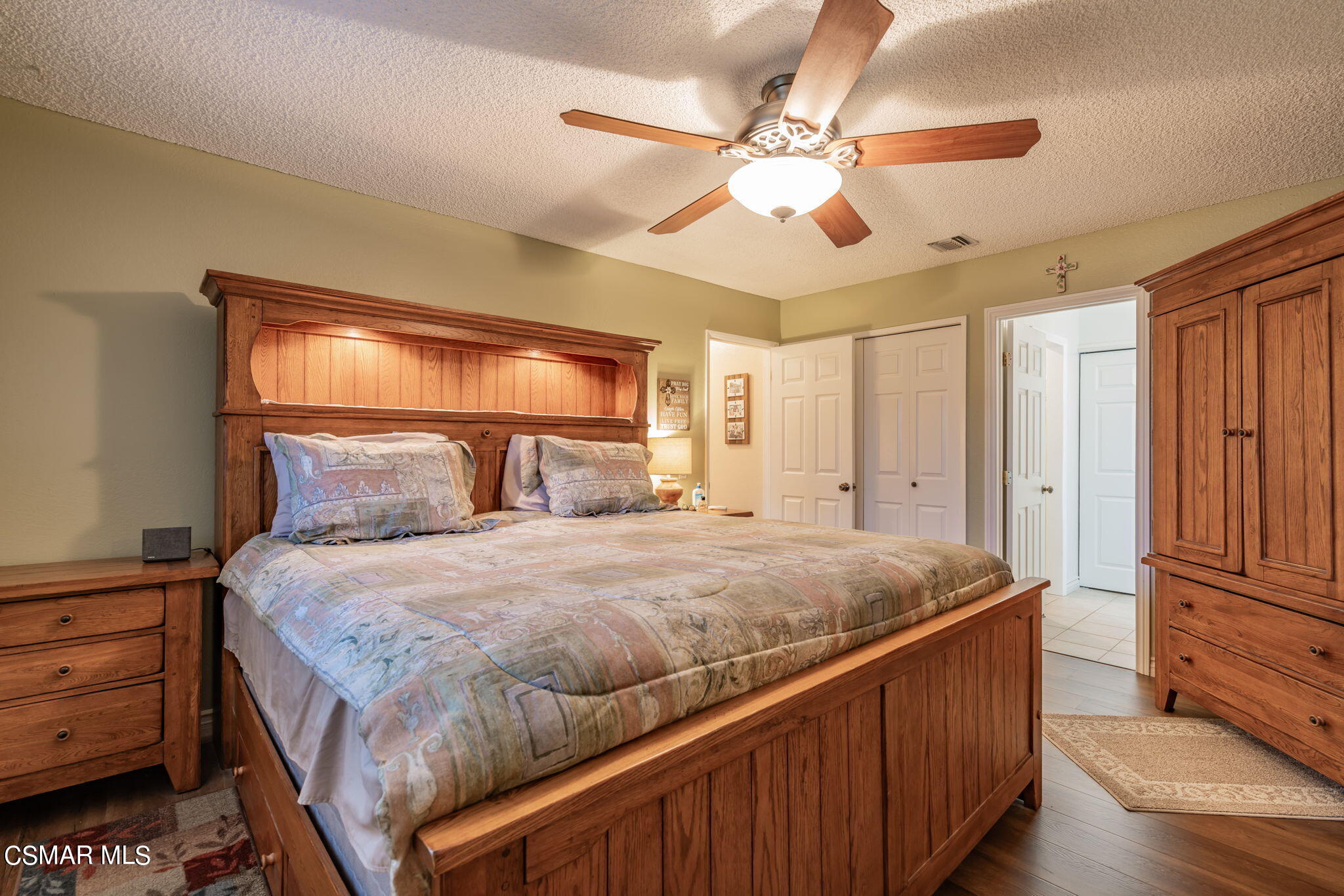 2044 Covington Avenue Simi Valley, CA 93065 - Photo 22 of 42 a bedroom with a bed and a chandelier