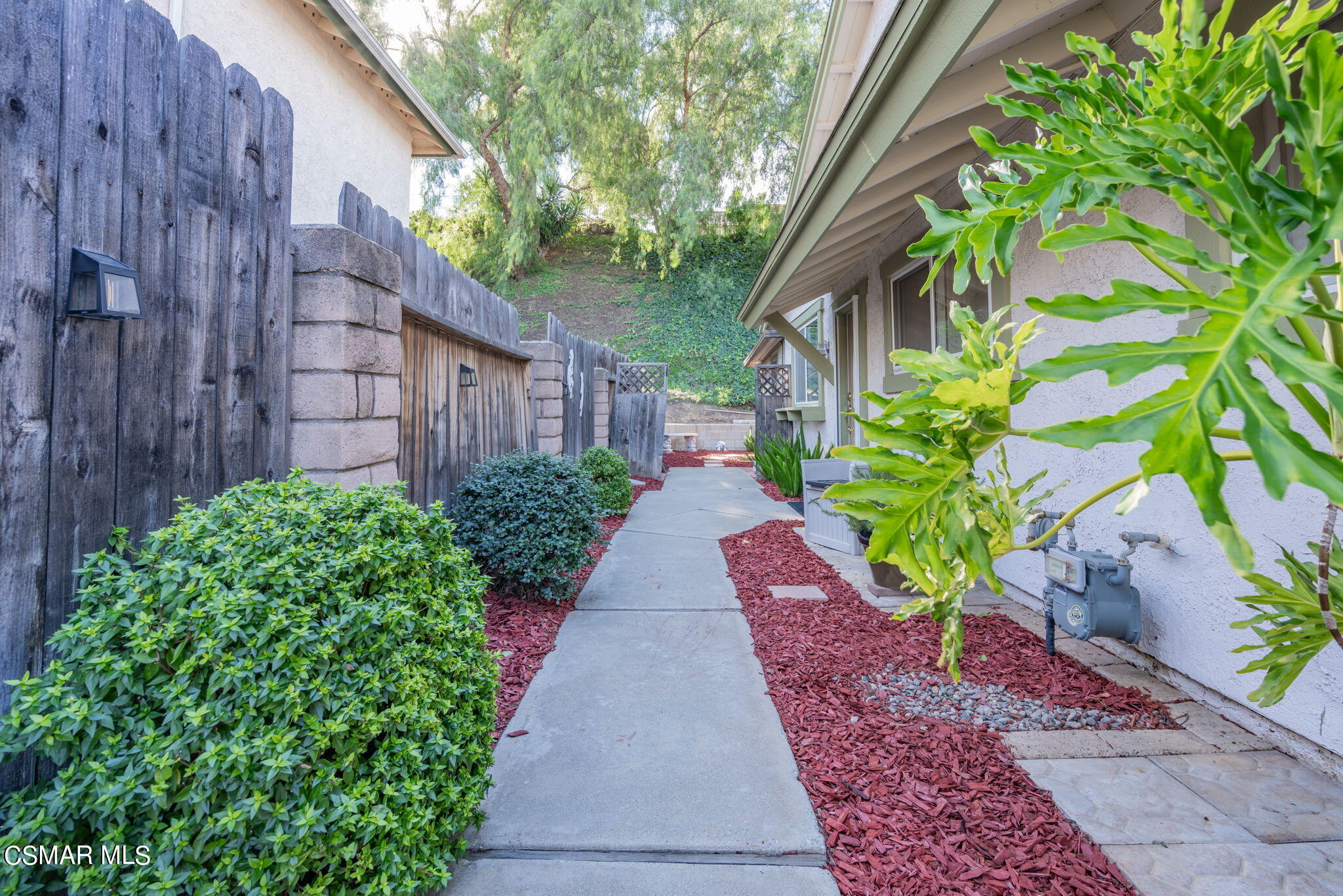 2044 Covington Avenue Simi Valley, CA 93065 - Photo 3 of 42 a view of a pathway with flower plants