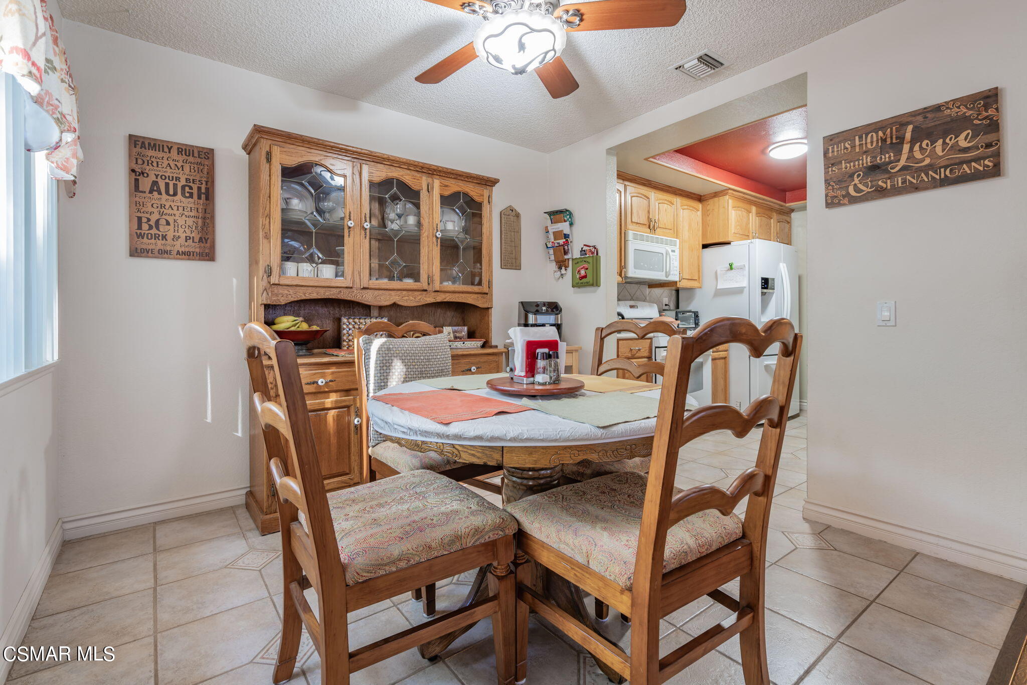 2044 Covington Avenue Simi Valley, CA 93065 - Photo 10 of 42 a view of a dining room with furniture and chandelier