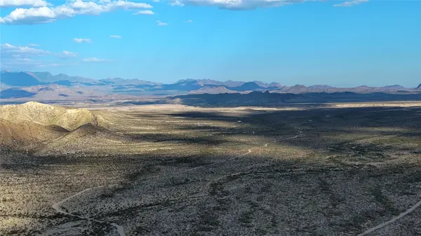 a view of an ocean and a mountain