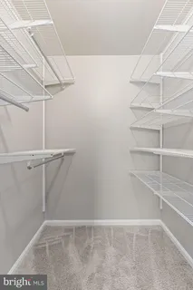 a view of an empty walk in closet