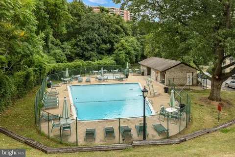 a view of a patio with table and chairs and potted plants