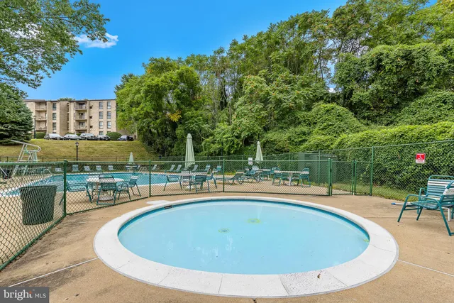 a view of a swimming pool with a patio