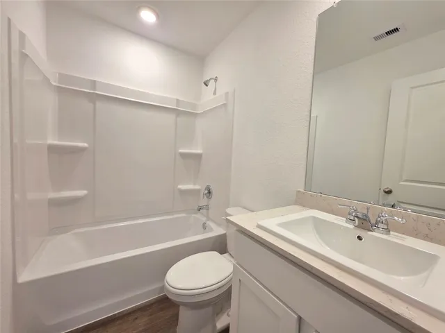 a bathroom with a sink toilet and bathtub
