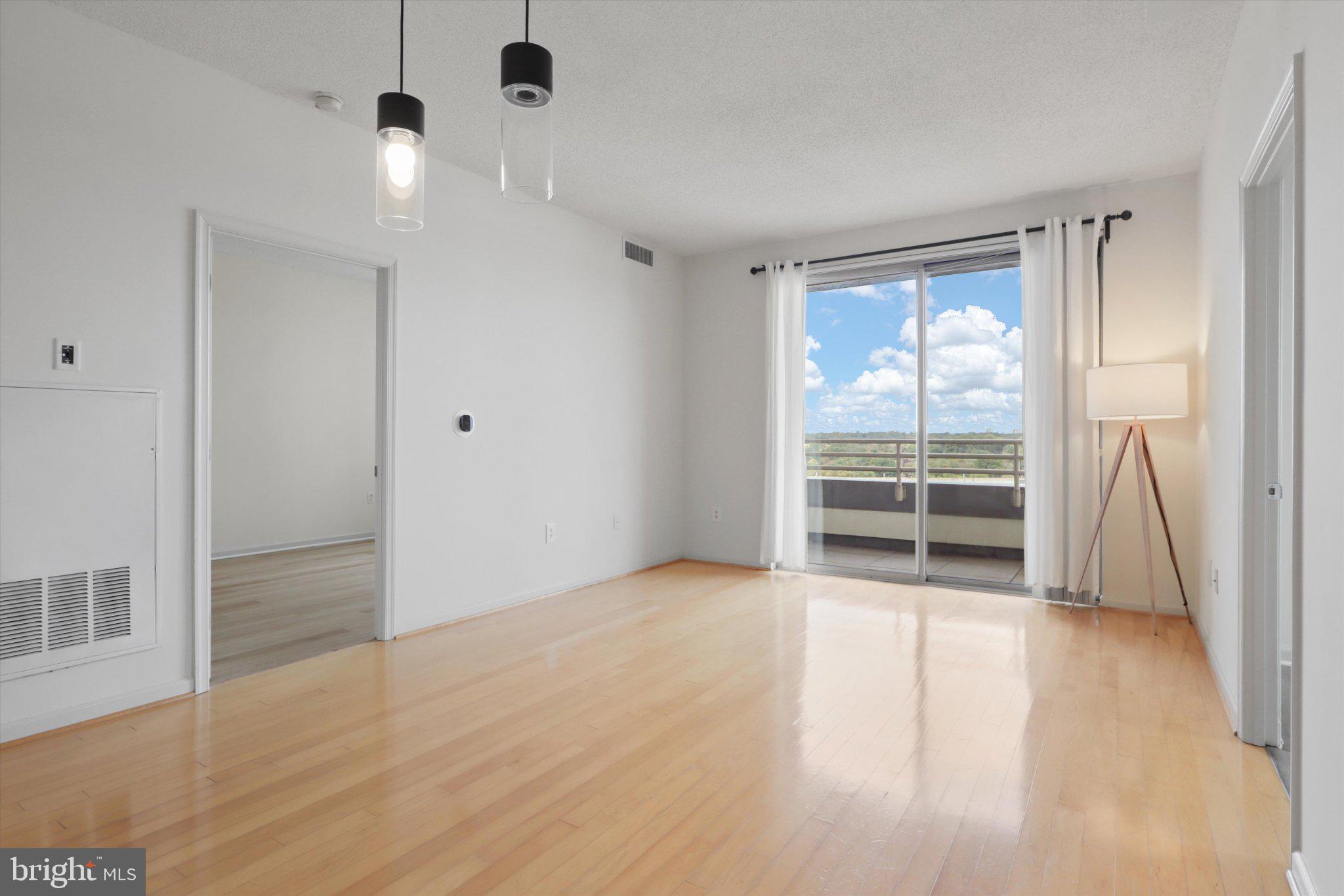 2726 Gallows Road, Unit 1506 Vienna, VA 22180 - Photo 8 of 35 Bright and airy living space with views.