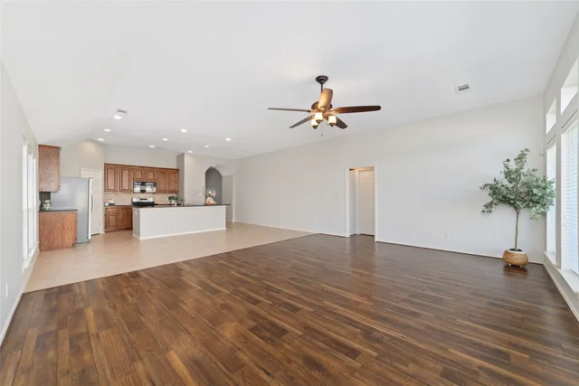 a view of a living room and kitchen with a sink