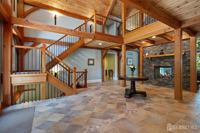 a kitchen with granite countertop a sink a counter top stainless steel appliances and cabinets