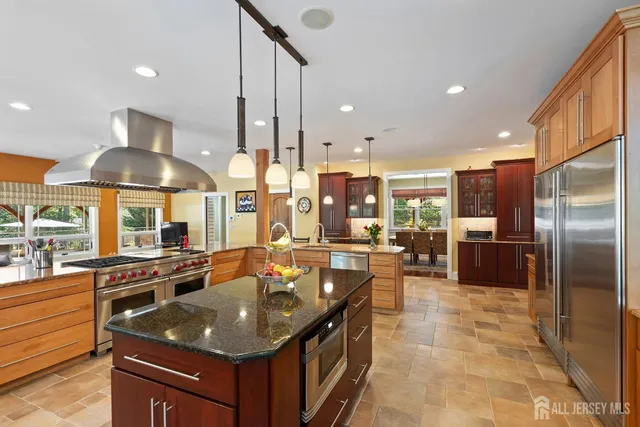a spacious bathroom with a sink and a mirror