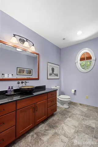 a bathroom with a toilet and a bathtub
