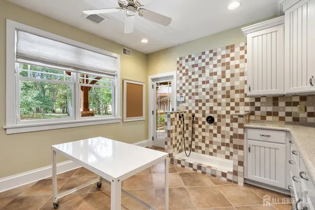a bathroom with a double vanity sink and a mirror