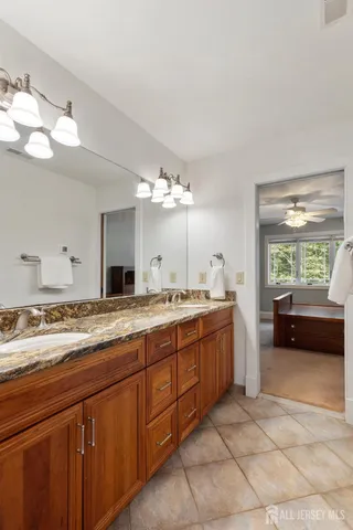 a view of a swimming pool with a yard and seating area