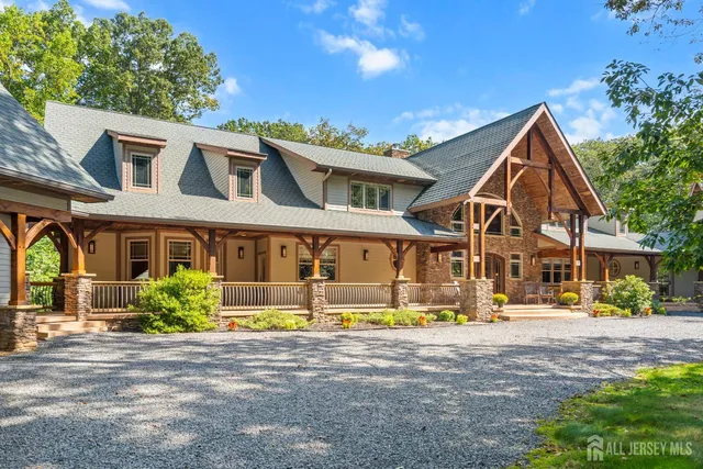 a view of a patio with table and chairs and floor to ceiling window