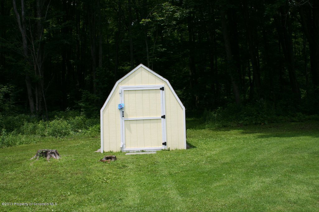 2155 Mccarty Road Nicholson, PA 18446 - Photo 33 of 40 a view of backyard with garden and garage