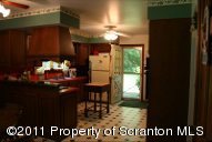 2155 Mccarty Road Nicholson, PA 18446 - Photo 8 of 40 a view of a dining room with furniture a chandelier and window