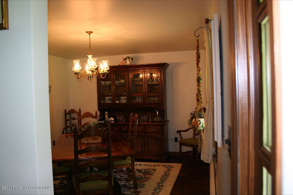 2155 Mccarty Road Nicholson, PA 18446 - Photo 9 of 40 a view of a dining room with furniture and chandelier