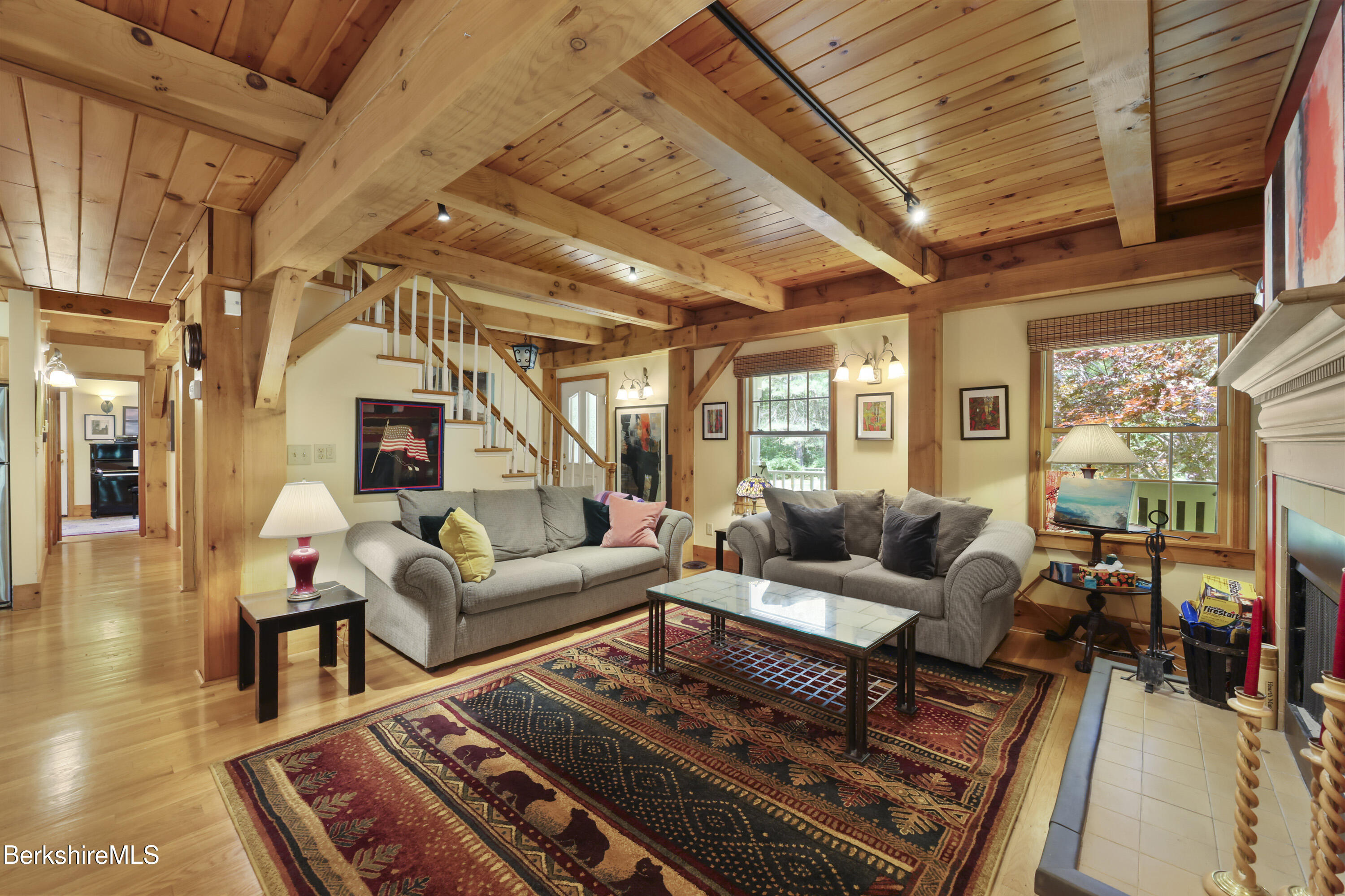 169 Jacobs Hollow Road Becket, MA 01223 - Photo 16 of 73 a living room with furniture a fireplace and a large window