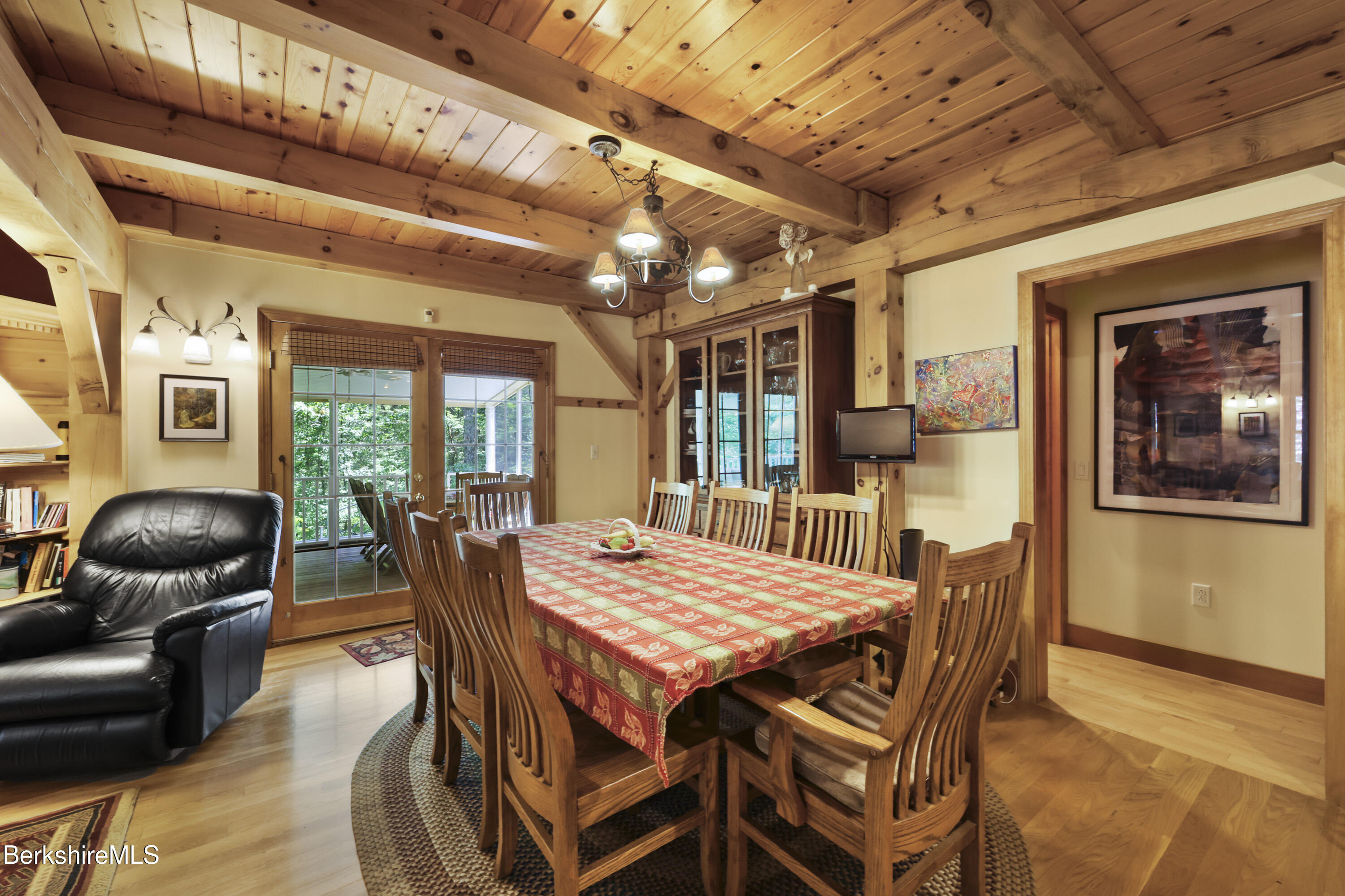 169 Jacobs Hollow Road Becket, MA 01223 - Photo 19 of 73 a dining room with furniture window and wooden floor