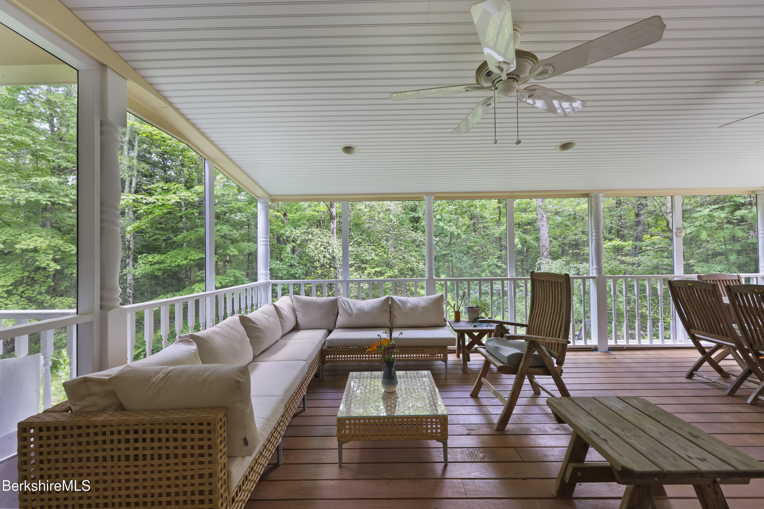 169 Jacobs Hollow Road Becket, MA 01223 - Photo 29 of 73 a living room with furniture and floor to ceiling windows