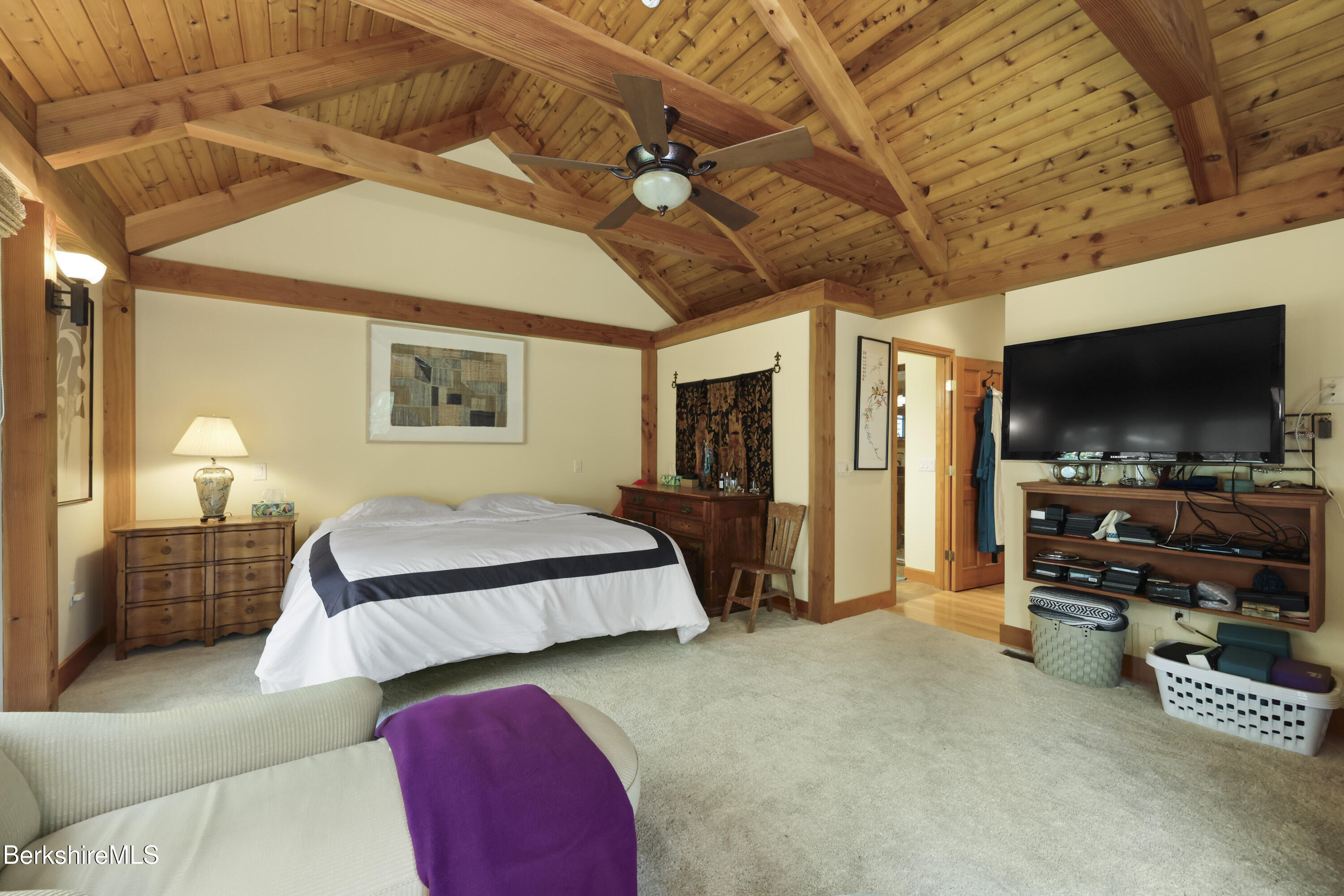 169 Jacobs Hollow Road Becket, MA 01223 - Photo 34 of 73 a bedroom with bed and a flat tv screen on dresser