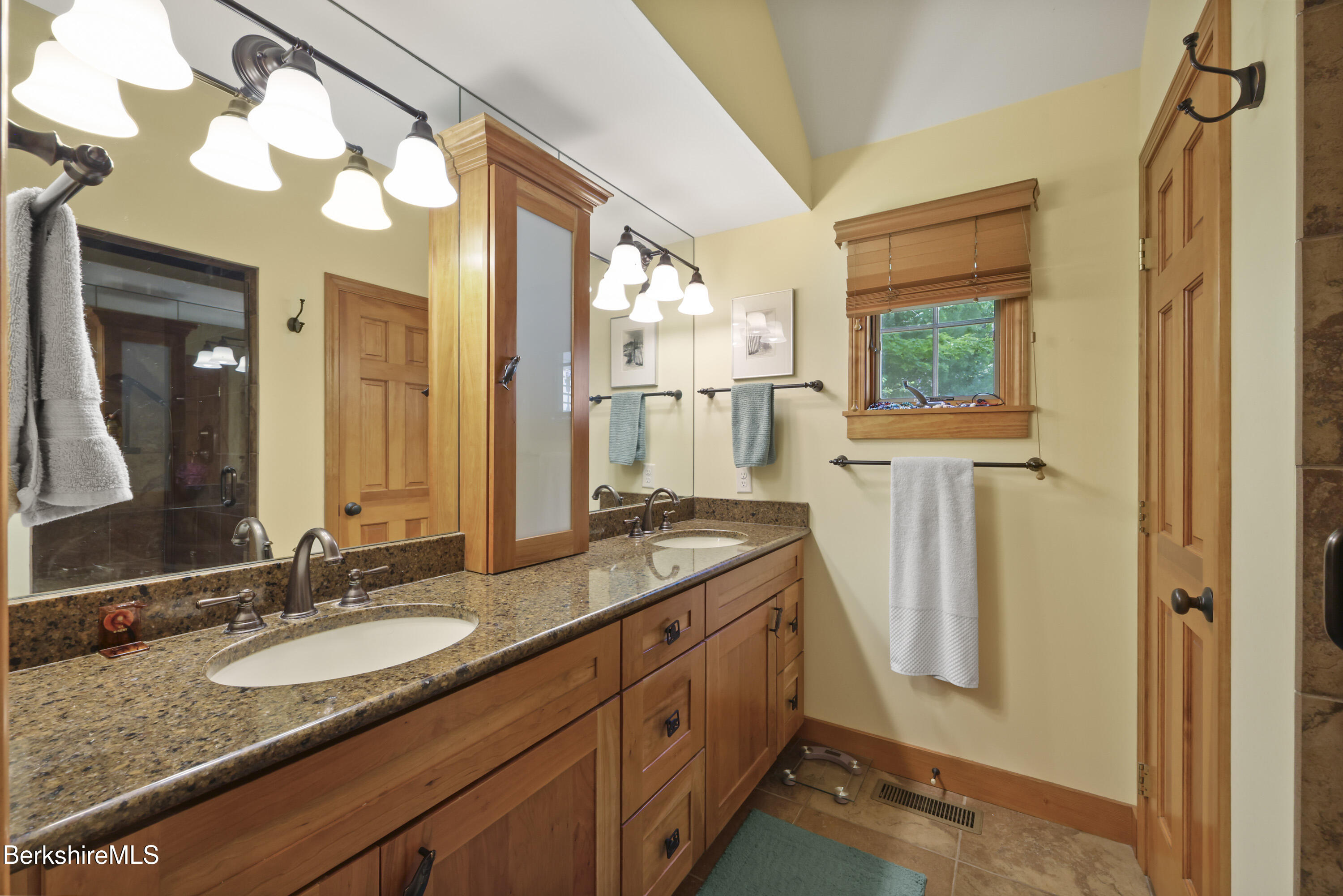 169 Jacobs Hollow Road Becket, MA 01223 - Photo 37 of 73 a bathroom with a granite countertop sink and a mirror