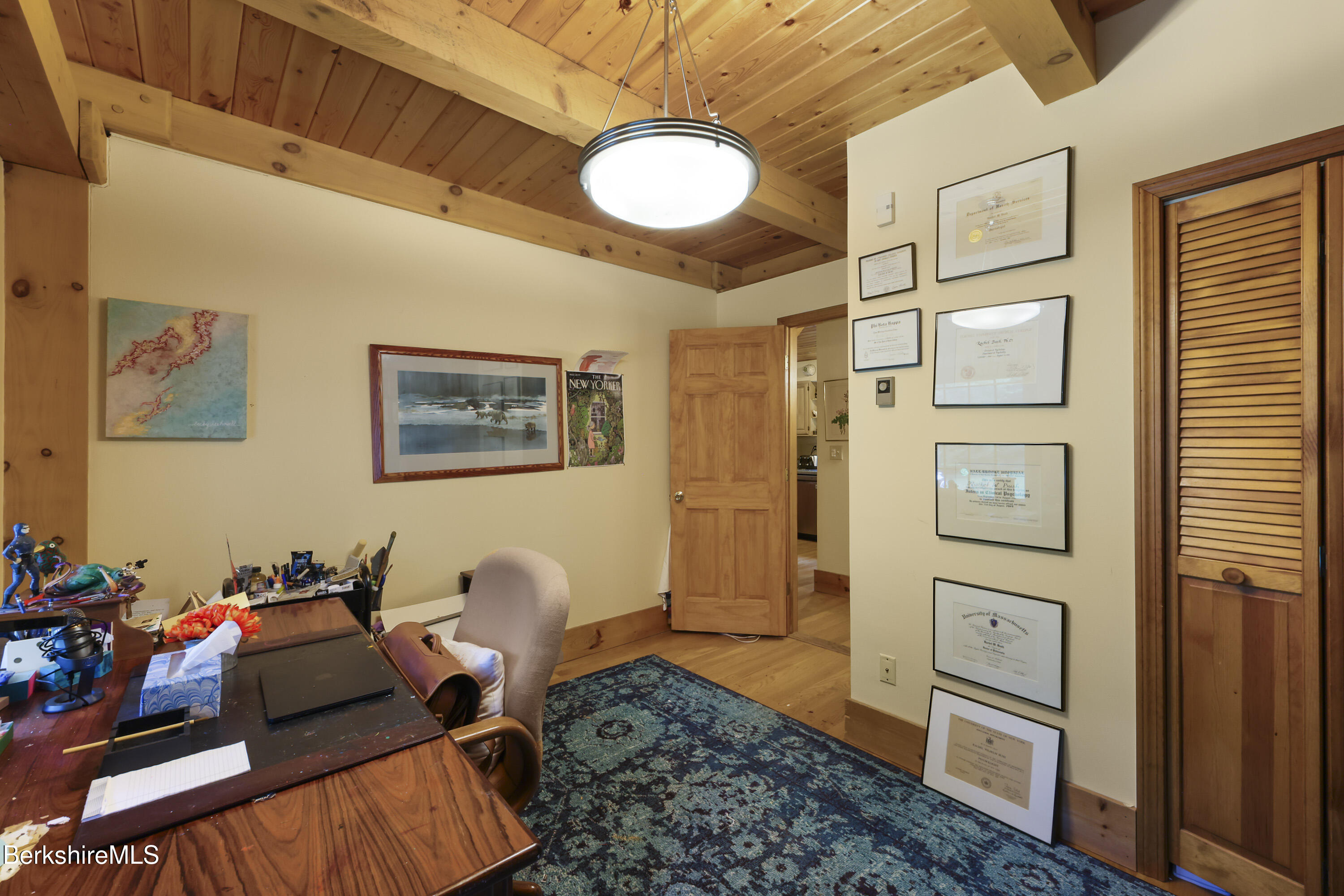 169 Jacobs Hollow Road Becket, MA 01223 - Photo 40 of 73 a living room with furniture and a table